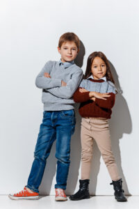 portrait-cute-little-boy-girl-stylish-jeans-clothes-looking-camera-studio